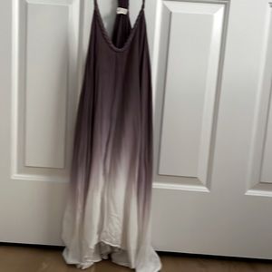 Unique boho sundress. Knee length or shorter. Loose flows fitting
